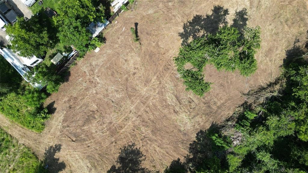 Tbd Arthur Street Elgin, TX 78621 - Photo 2 of 15 a view of a yard with plants and large trees