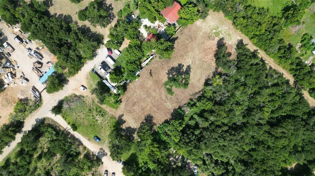 Tbd Arthur Street Elgin, TX 78621 - Photo 4 of 15 an aerial view of a house with a yard and covered with trees