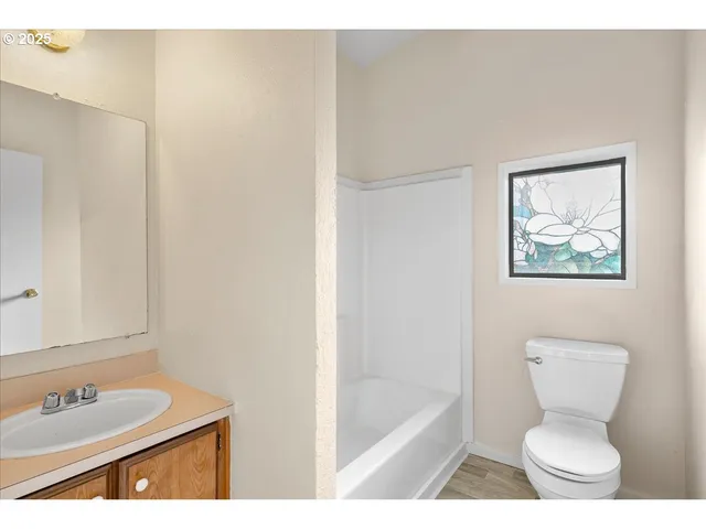 a bathroom with a toilet a sink and a bathtub