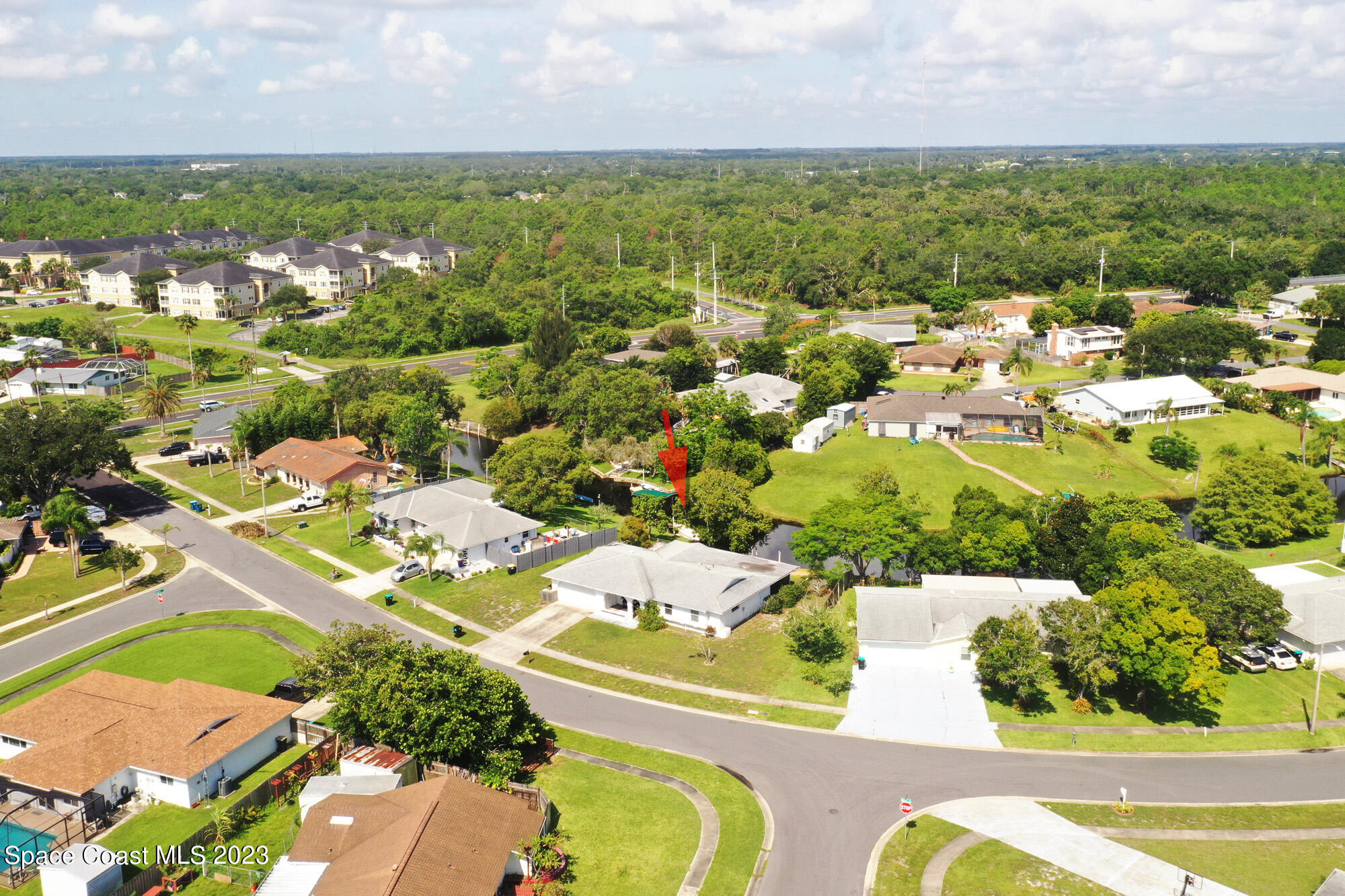 813 Vance Circle Northeast Palm Bay, FL 32905 - Photo 2 of 29 an aerial view of residential houses with outdoor space and river