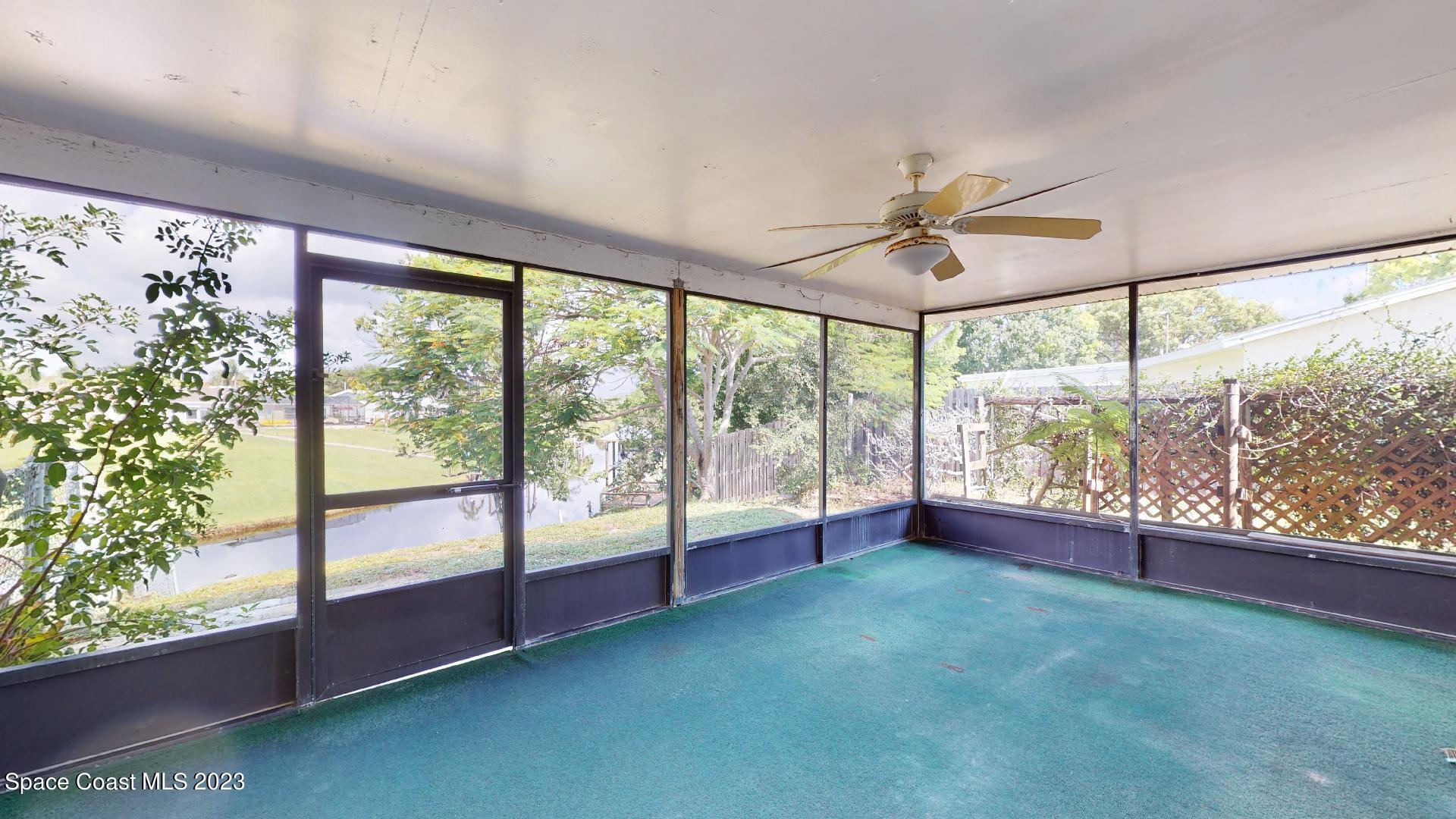 813 Vance Circle Northeast Palm Bay, FL 32905 - Photo 21 of 29 a view of an empty room with a large window