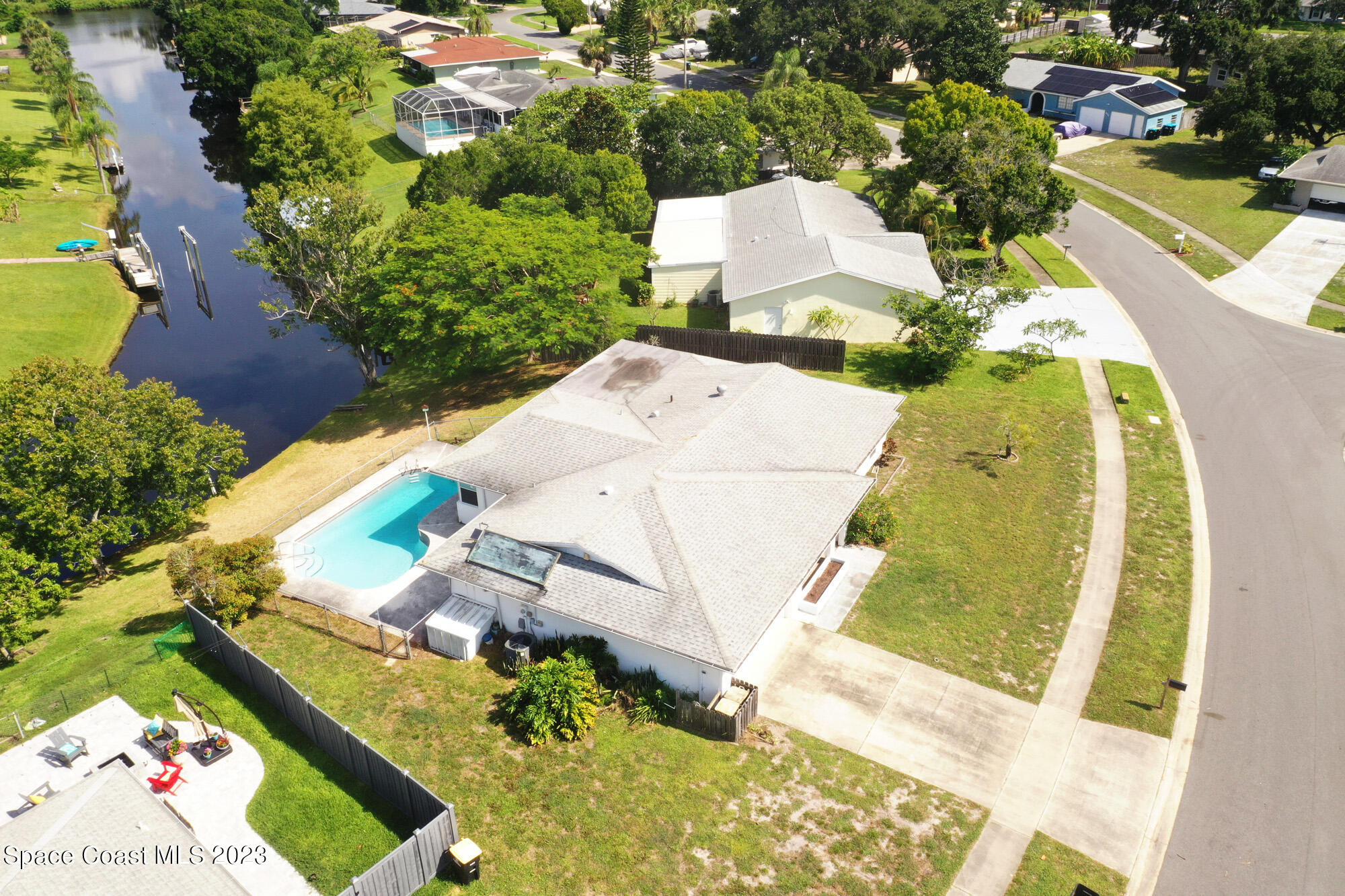 813 Vance Circle Northeast Palm Bay, FL 32905 - Photo 3 of 29 an aerial view of a house with a swimming pool