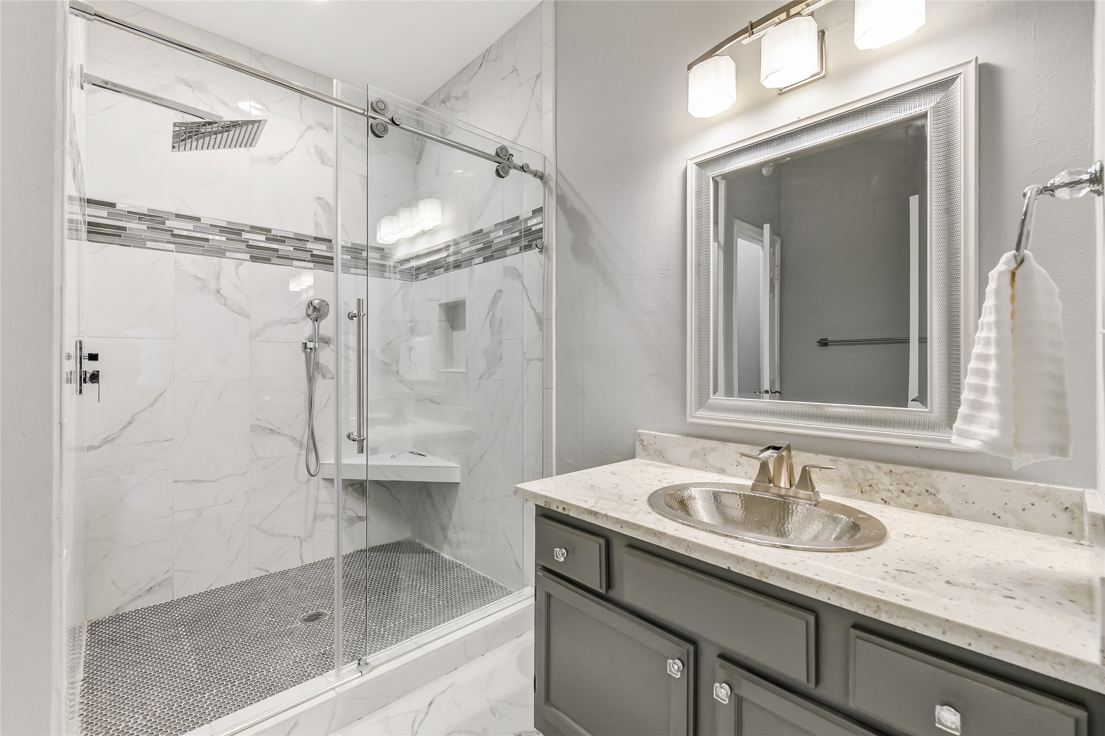 4001 Tanglewilde Street, Unit 1402 Houston, TX 77063 - Photo 15 of 23 Experience luxury in the primary bath's wet area, featuring an oversized shower with an Amazon rain shower head, elegant fittings, and a second sink with a stylish vanity.
