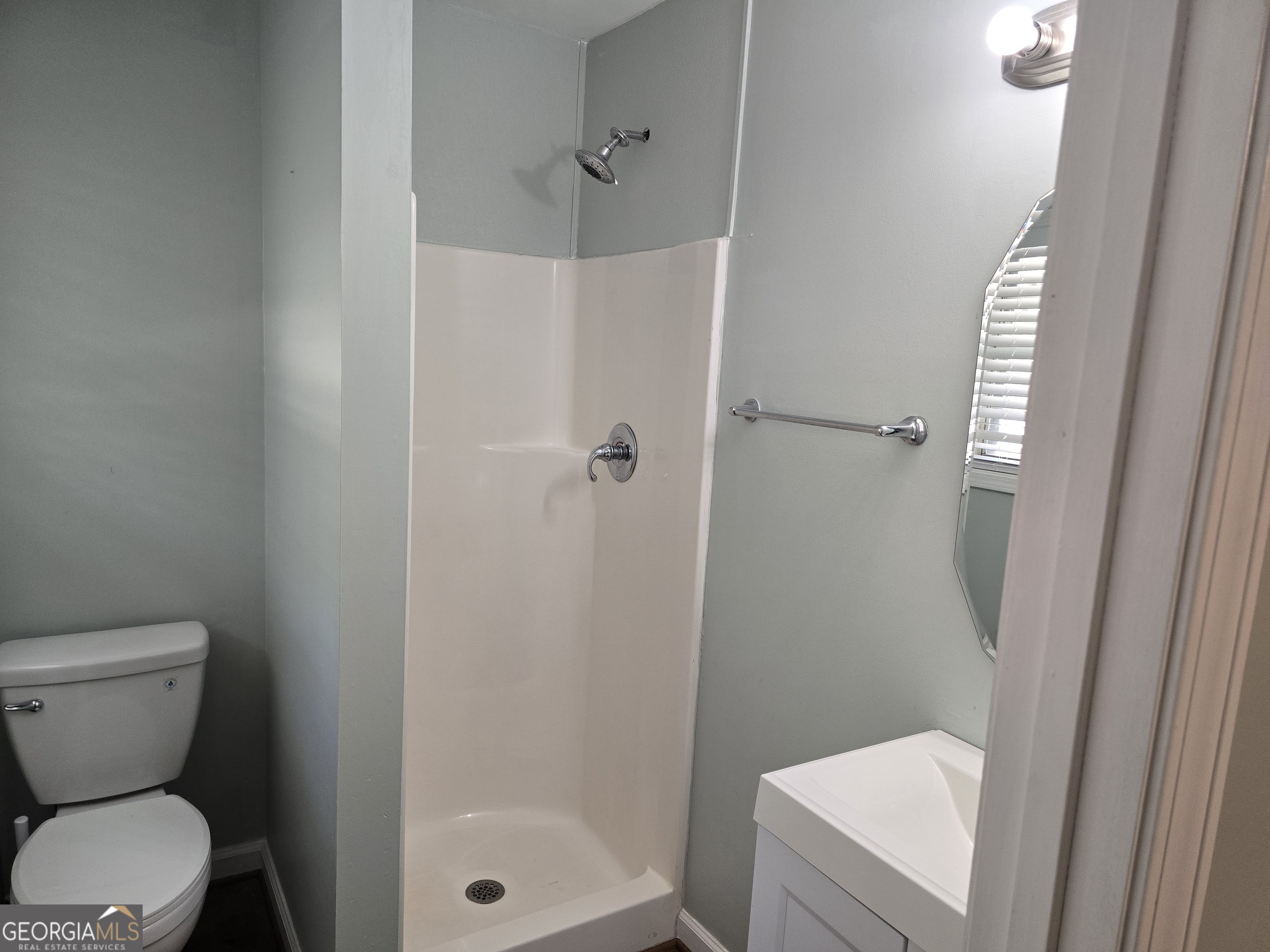 205 Emory Way Oxford, GA 30054 - Photo 11 of 18 a bathroom with a toilet and a shower