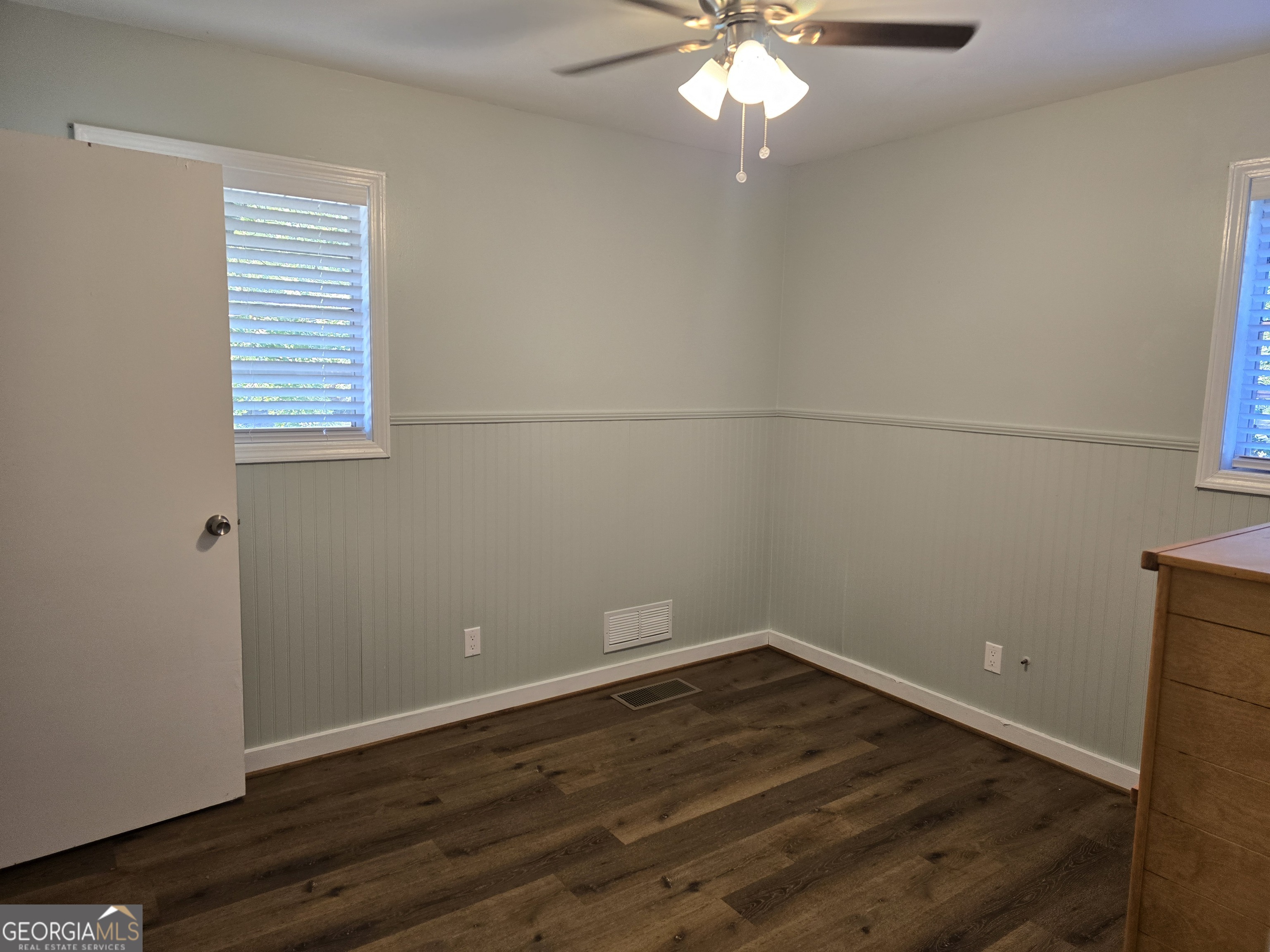 205 Emory Way Oxford, GA 30054 - Photo 14 of 18 an empty room with wooden floor and windows