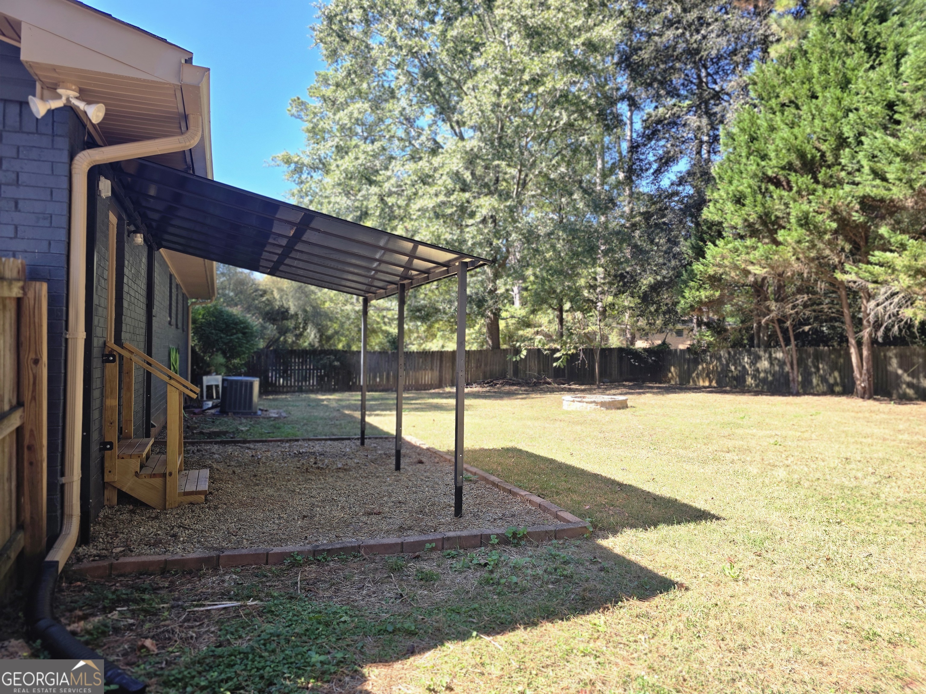 205 Emory Way Oxford, GA 30054 - Photo 17 of 18 a view of a backyard with basketball court