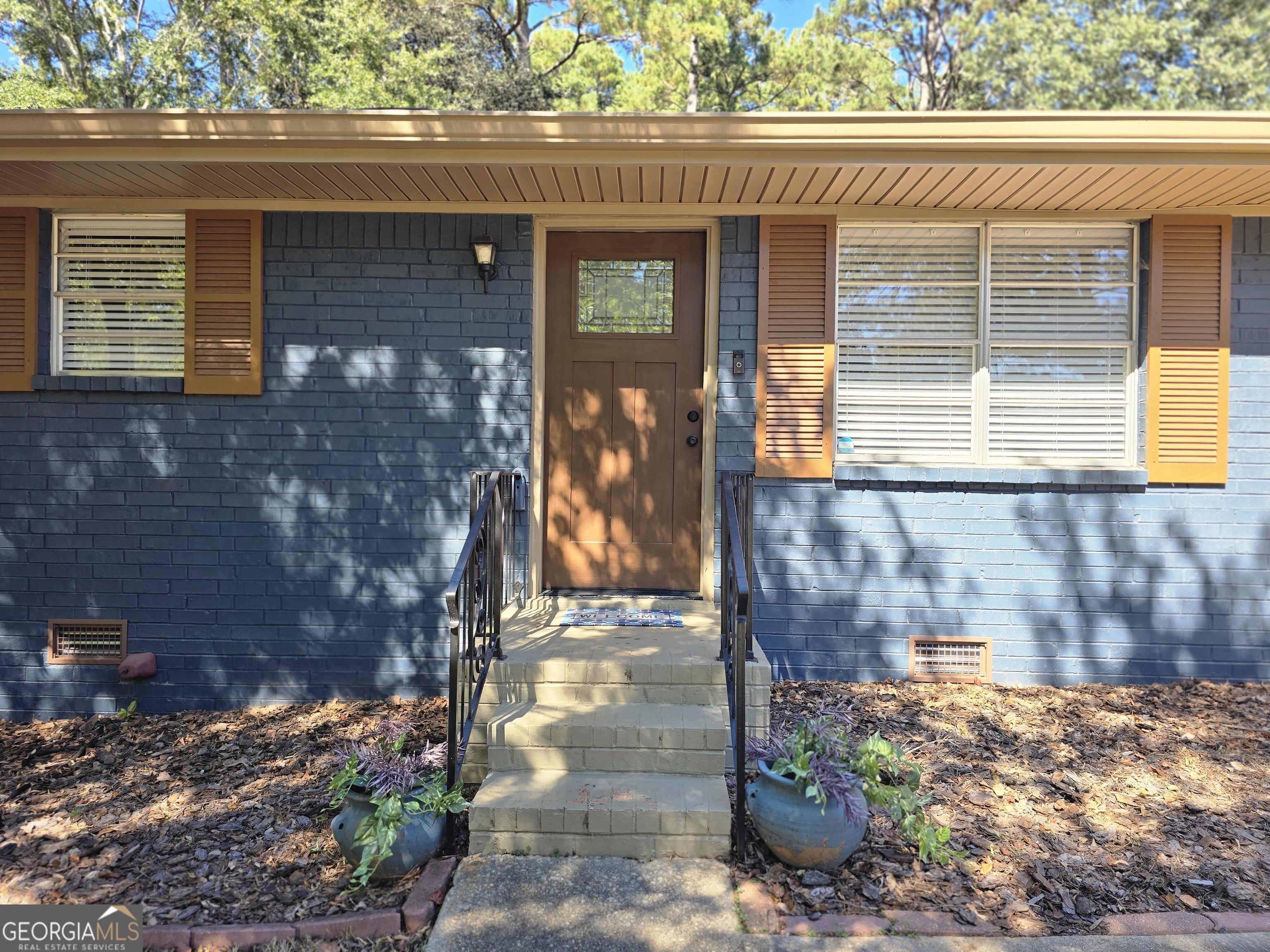 205 Emory Way Oxford, GA 30054 - Photo 3 of 18 a front view of a house with a yard