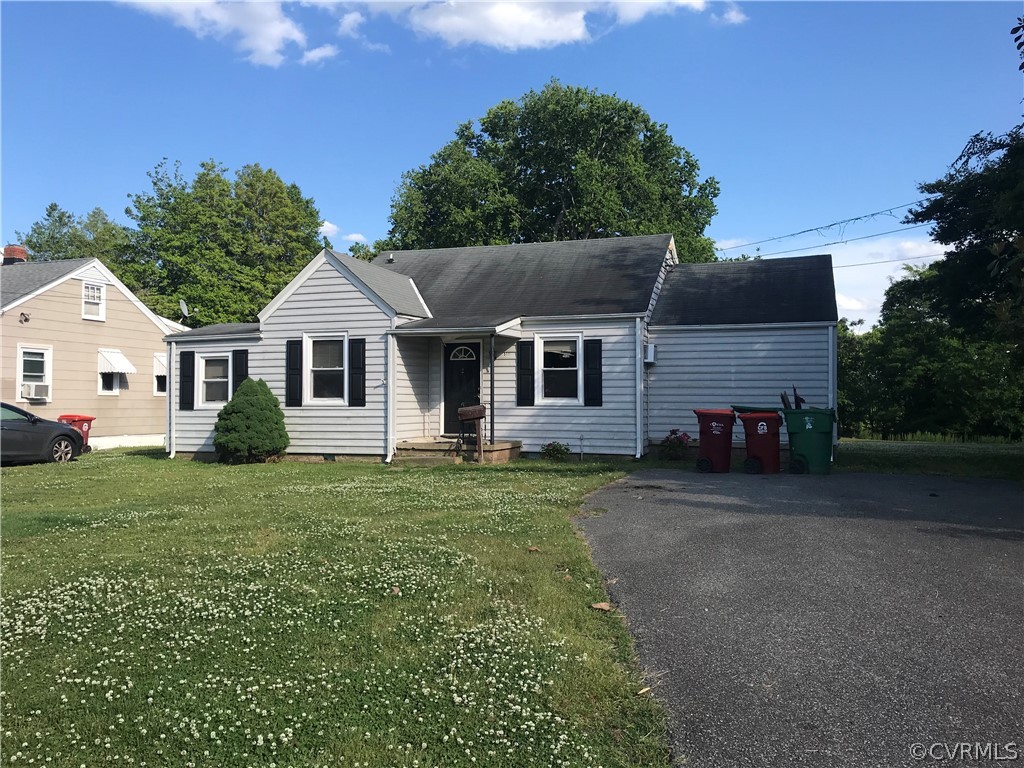 511 Riverview Road Colonial Heights, VA 23834 - Photo 2 of 17 a front view of a house with a garden
