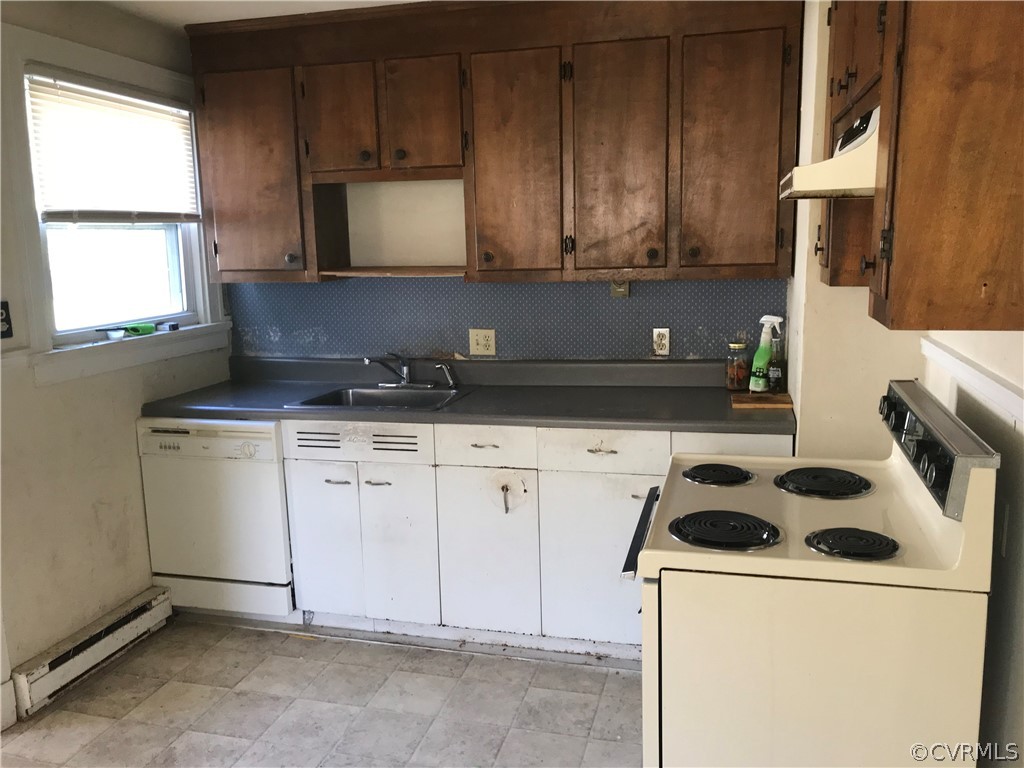 511 Riverview Road Colonial Heights, VA 23834 - Photo 3 of 17 a kitchen with a sink a stove and cabinets