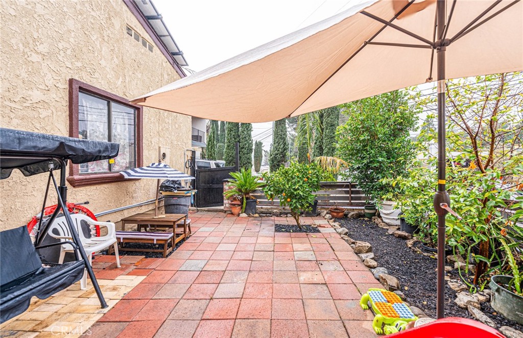 10334 Big Tujunga Canyon Road Tujunga, CA 91042 - Photo 16 of 39 a view of a chairs and table in a backyard