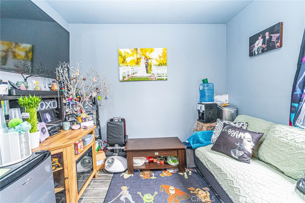 10334 Big Tujunga Canyon Road Tujunga, CA 91042 - Photo 22 of 39 a living room with furniture and a flat screen tv