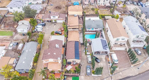 an aerial view of a house with swimming pool