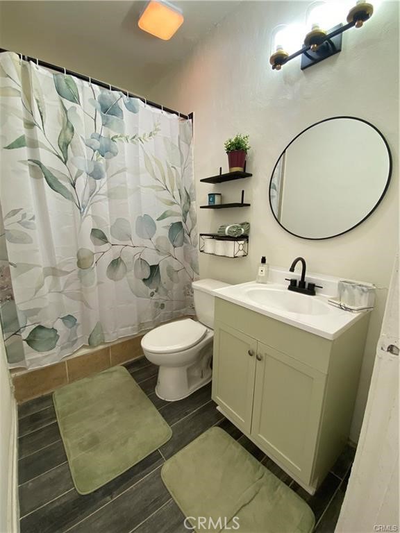 10334 Big Tujunga Canyon Road Tujunga, CA 91042 - Photo 6 of 39 a bathroom with a toilet sink and mirror