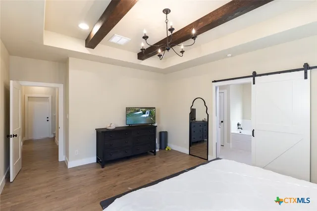 a bedroom with a bed and a dresser