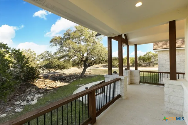 a view of balcony with furniture