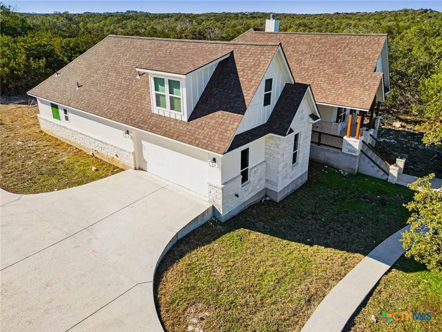 an aerial view of house with yard