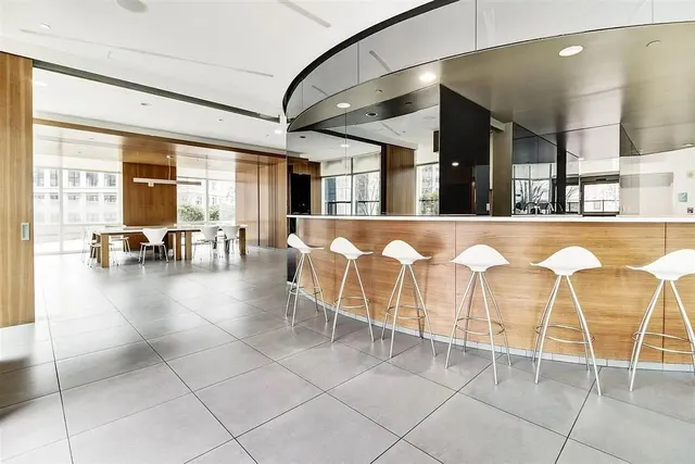 a room with gym equipment and large window