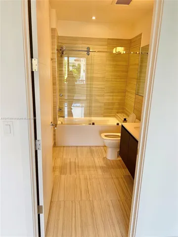 a view of kitchen with cabinets