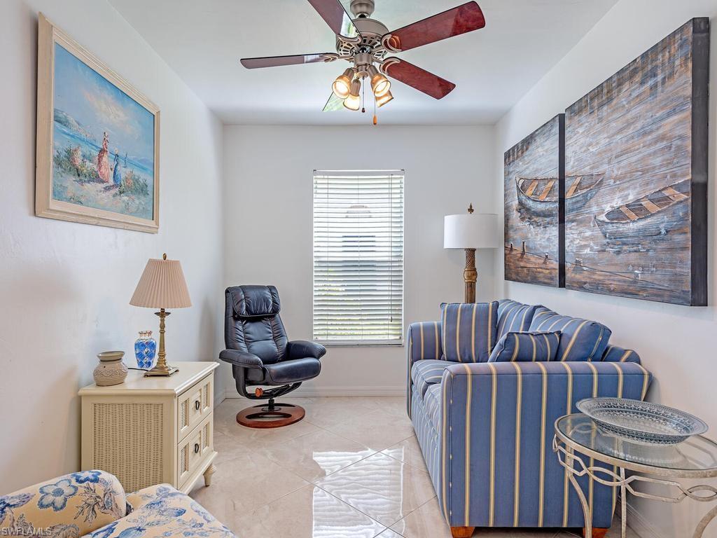 472 St Andrews Boulevard Naples, FL 34113 - Photo 17 of 18 a view of a livingroom with workspace and a couch