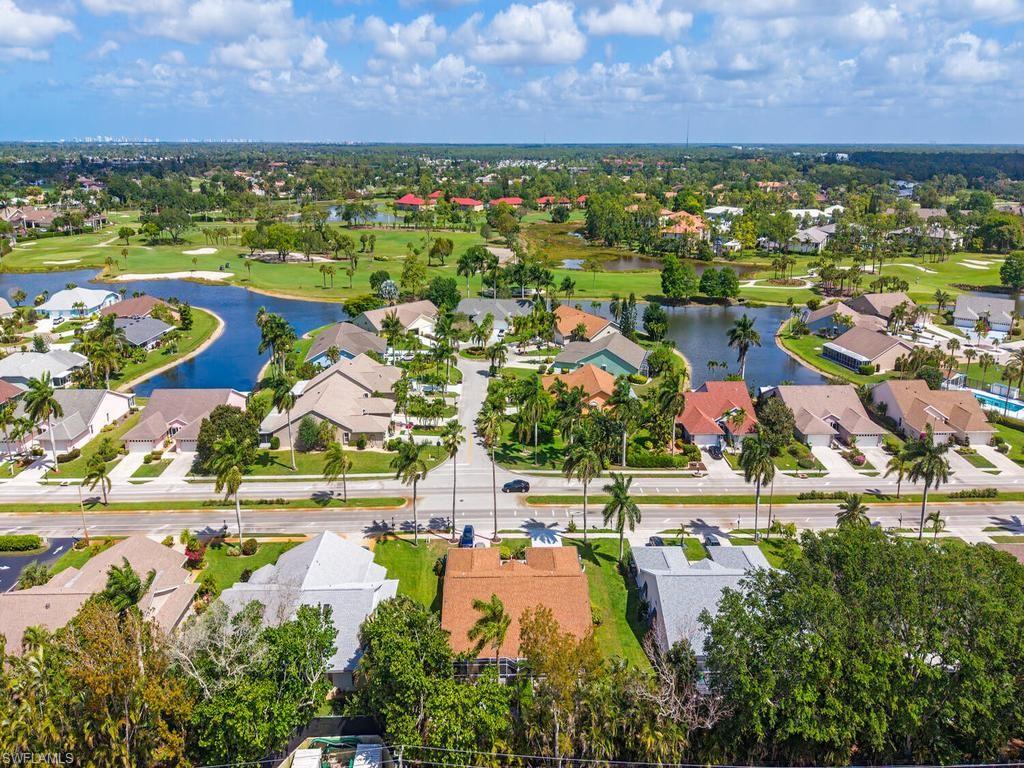 472 St Andrews Boulevard Naples, FL 34113 - Photo 2 of 18 an aerial view of residential houses with outdoor space