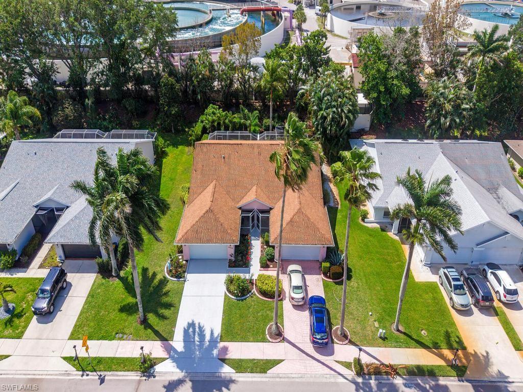 472 St Andrews Boulevard Naples, FL 34113 - Photo 4 of 18 an aerial view of houses with yard