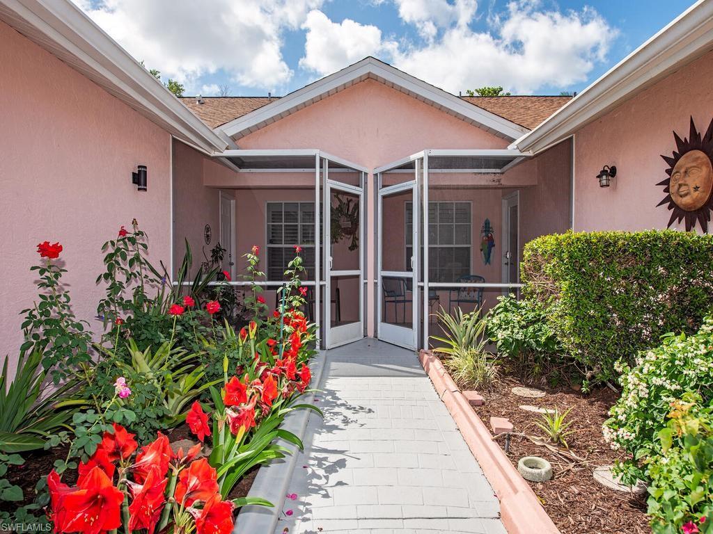 472 St Andrews Boulevard Naples, FL 34113 - Photo 6 of 18 a view of a entryway front of house