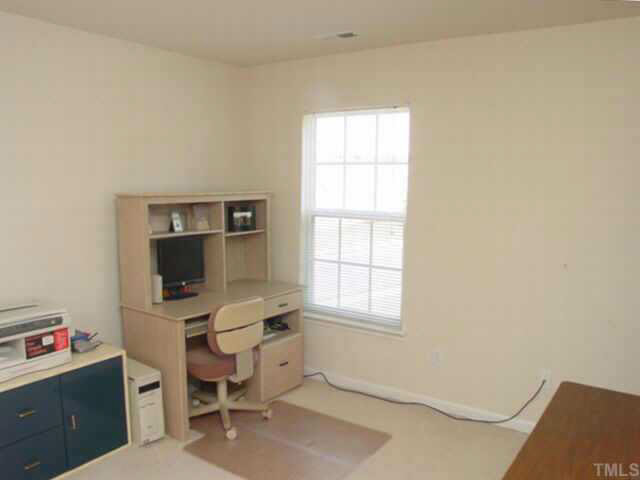 204 Willingham Road Morrisville, NC 27560 - Photo 6 of 10 a view of a workspace with furniture and a window