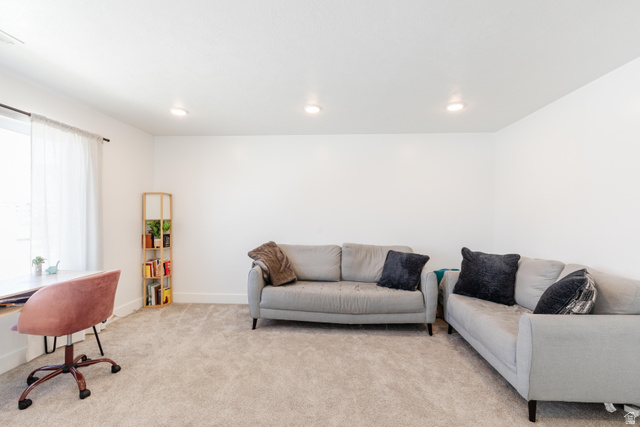 349 West 3085 South Logan, UT 84321 - Photo 23 of 37 Carpeted room featuring recessed lighting, a white wall finish, and a window with sheer curtains