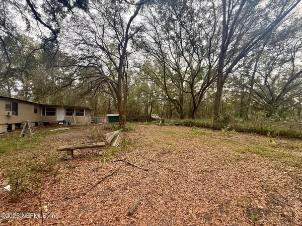 a backyard of a house with lots of green space