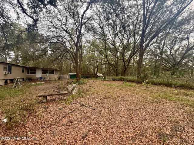 a backyard of a house with lots of green space