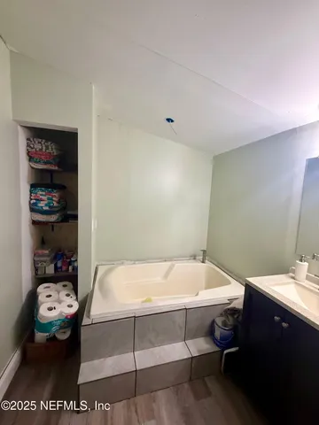 a bathroom with a sink toilet and a bathtub