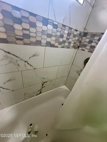 a bathroom with a bathtub