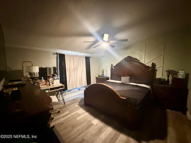 a bedroom with a bed and lamp