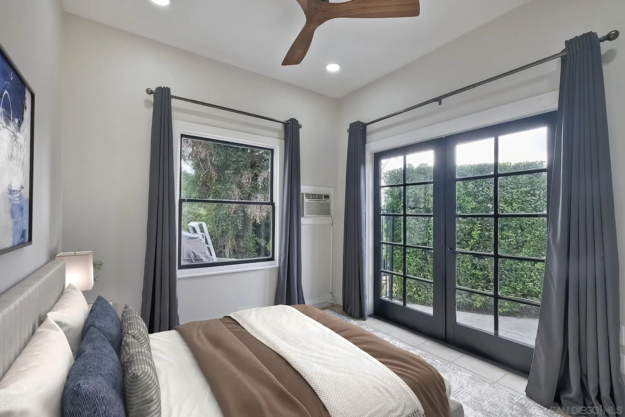 602 South Grape Street, Unit A Escondido, CA 92025 - Photo 13 of 31 a bedroom with a large bed and a window