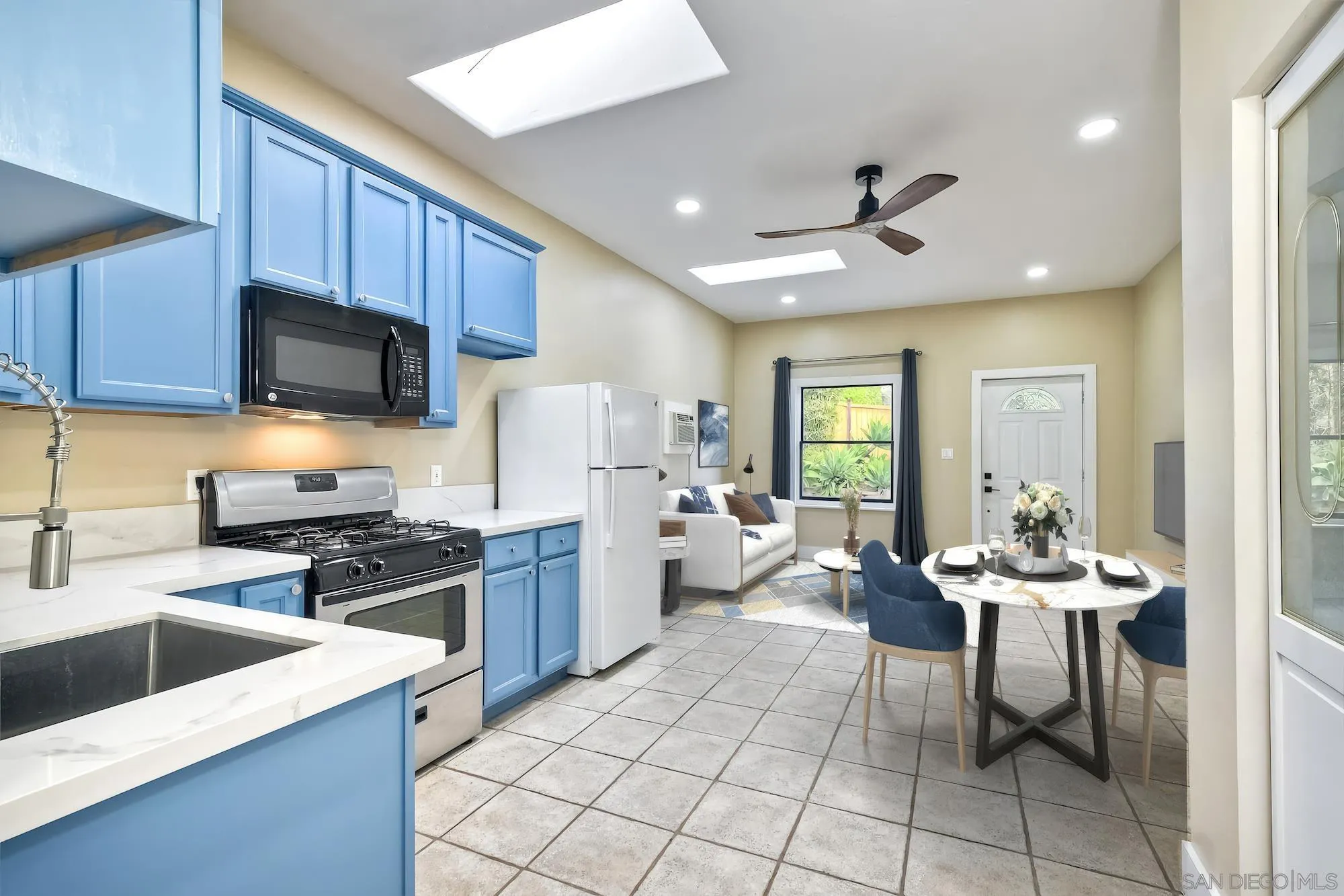 602 South Grape Street, Unit A Escondido, CA 92025 - Photo 8 of 31 a kitchen with a sink a stove and chairs