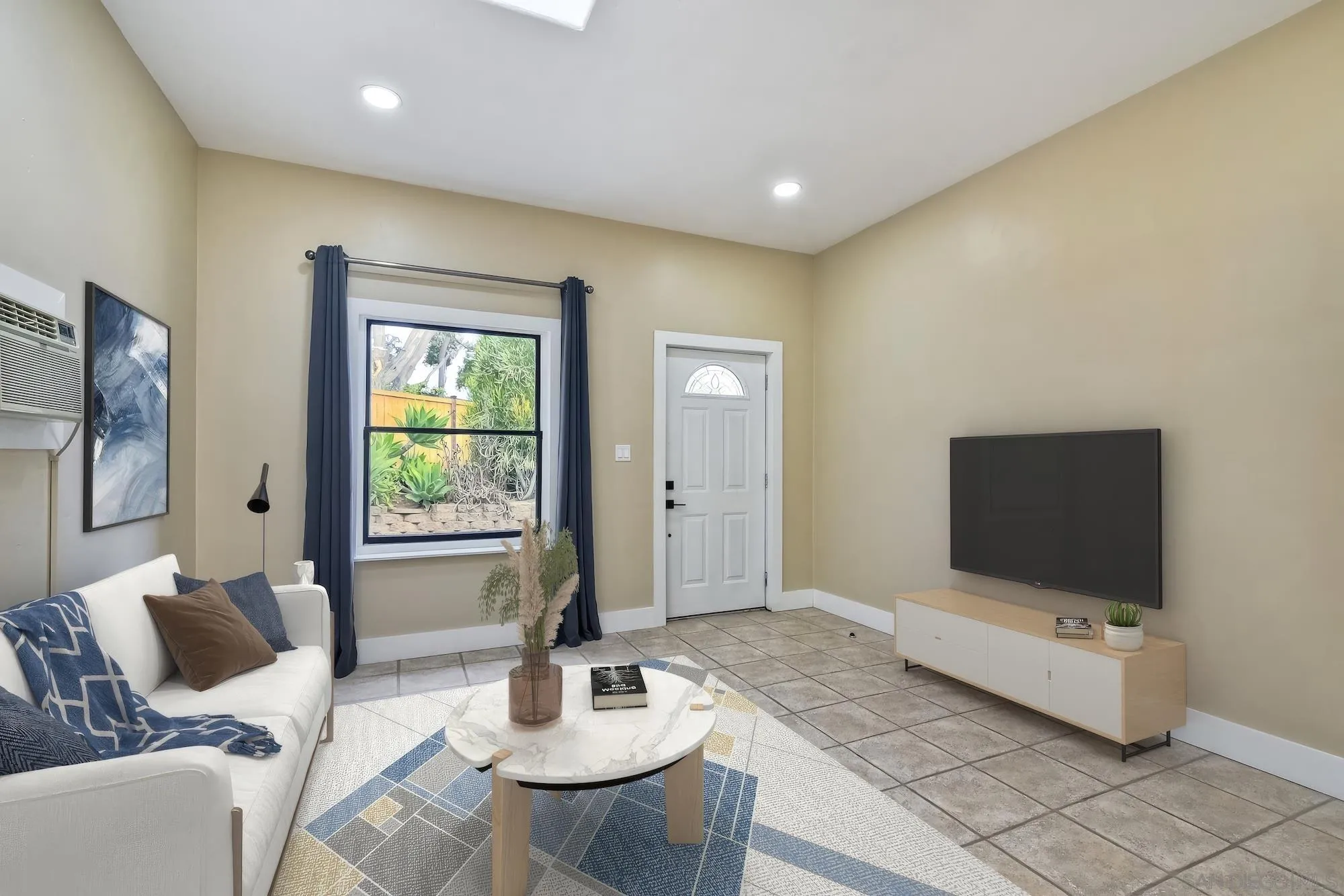 602 South Grape Street, Unit A Escondido, CA 92025 - Photo 9 of 31 a living room with furniture and a flat screen tv