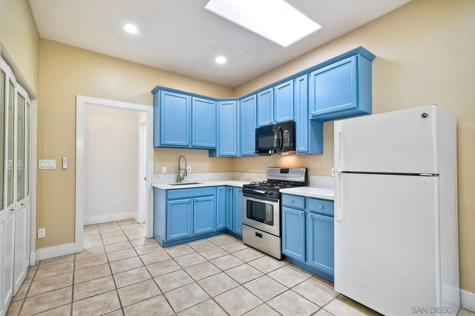 602 South Grape Street, Unit A Escondido, CA 92025 - Photo 10 of 31 a kitchen with stainless steel appliances granite countertop a refrigerator stove a sink and dishwasher