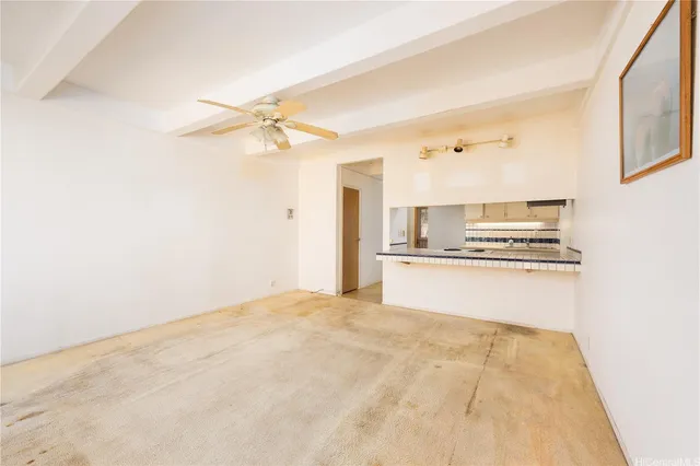 a view of kitchen with granite countertop cabinets and black appliances