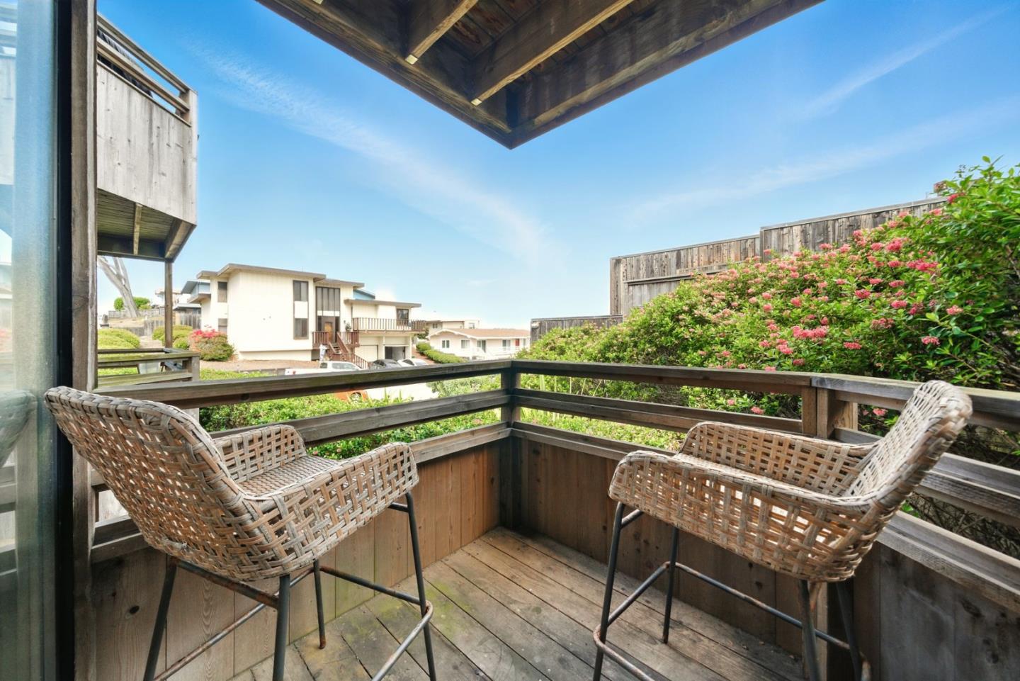 125 Surf Way, Unit 343 Monterey, CA 93940 - Photo 5 of 8 a view of a chairs and table in the balcony