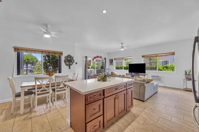 a large kitchen with a table and chairs
