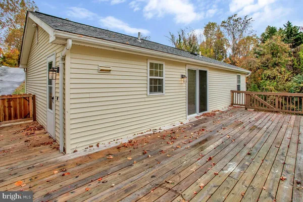a backyard of a house with wooden floor
