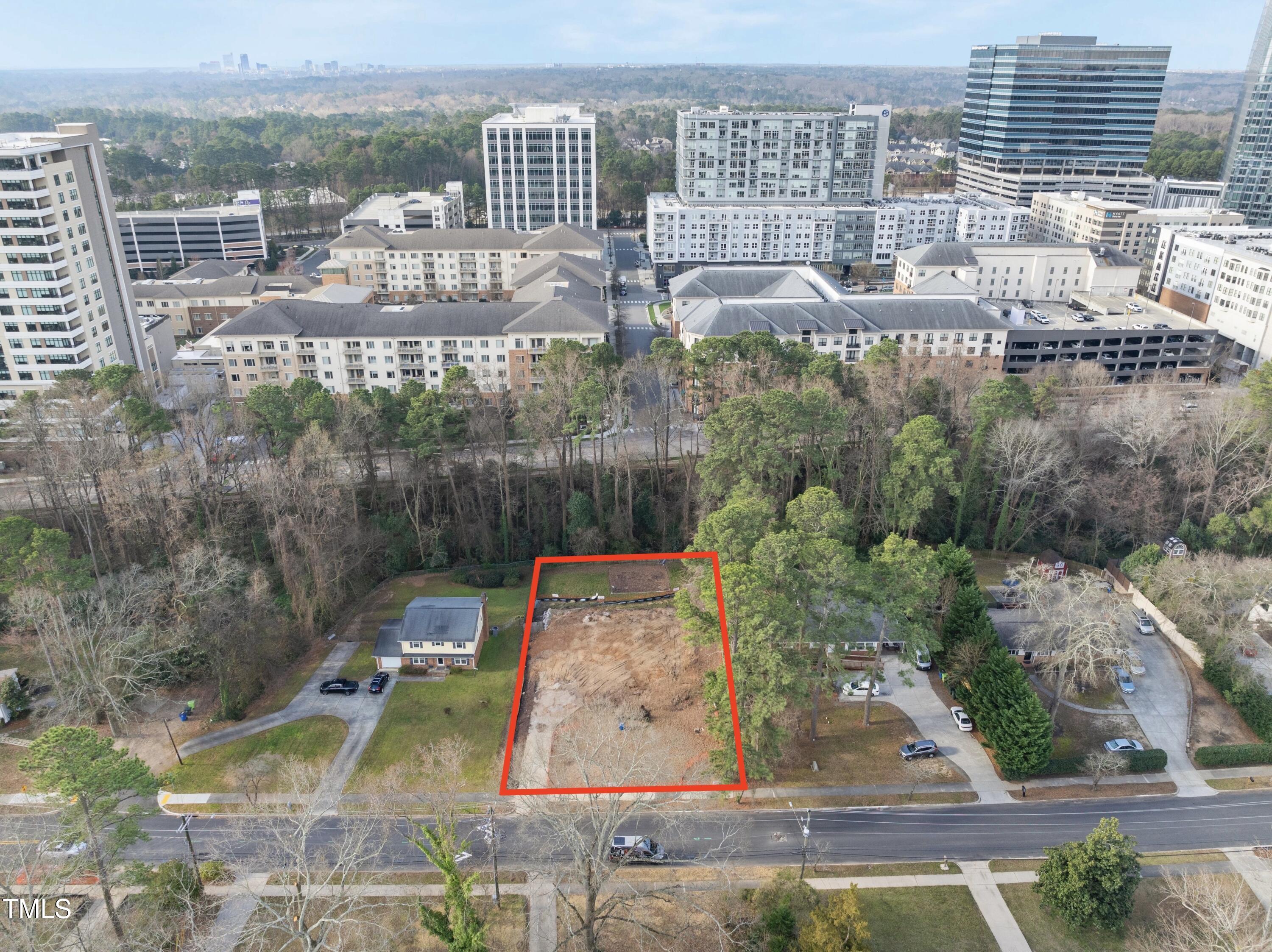 216 Dartmouth Road Raleigh, NC 27609 - Photo 2 of 5 a view of a city with tall buildings