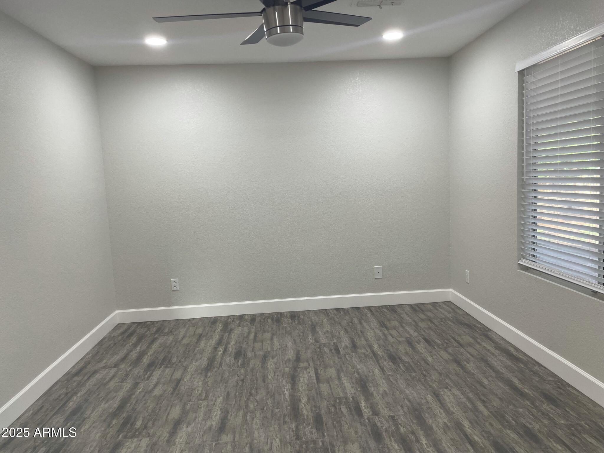 839 West 12th Avenue Apache Junction, AZ 85120 - Photo 12 of 26 a view of an empty room with a window