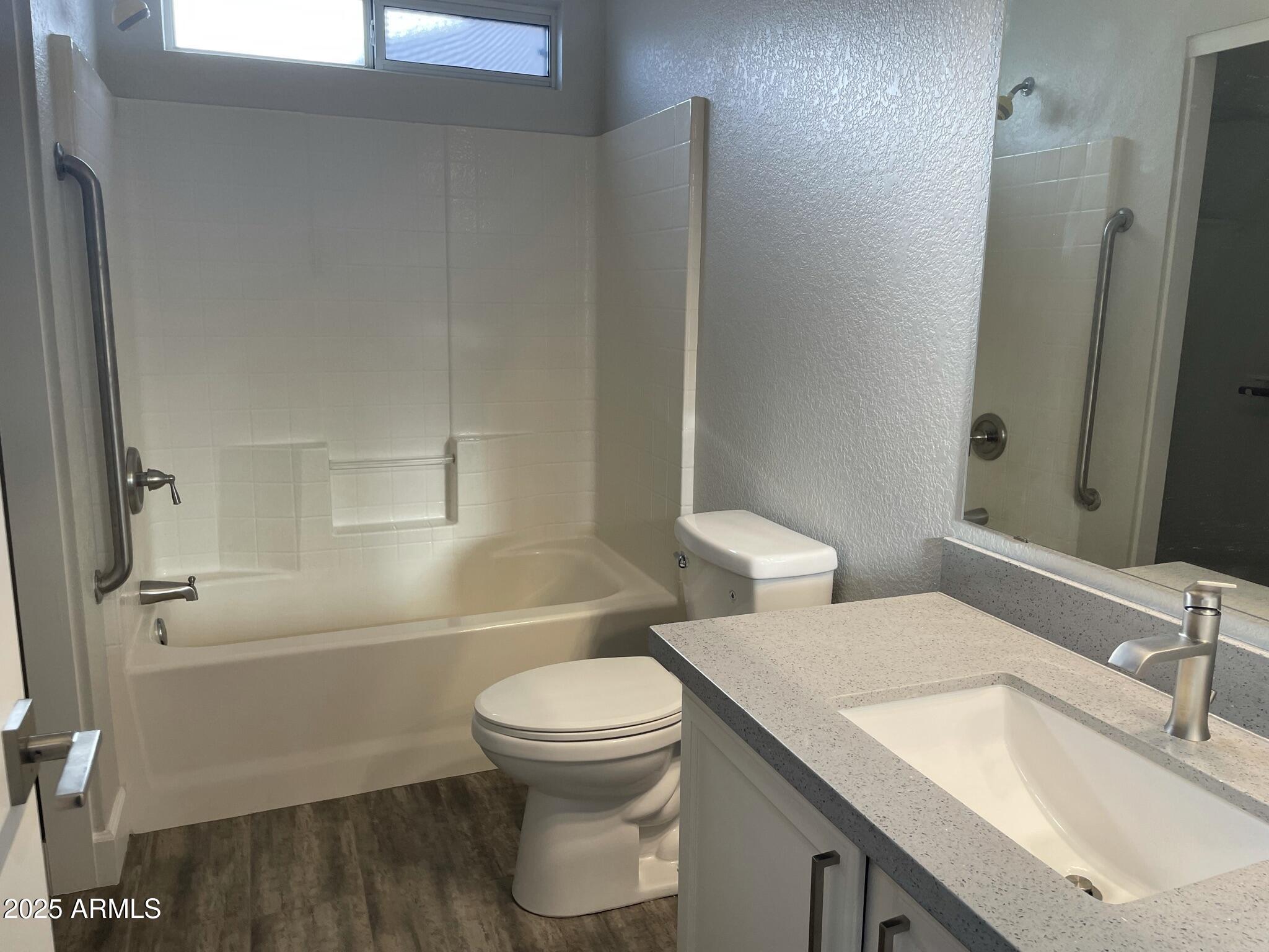 839 West 12th Avenue Apache Junction, AZ 85120 - Photo 13 of 26 a bathroom with a sink toilet and shower