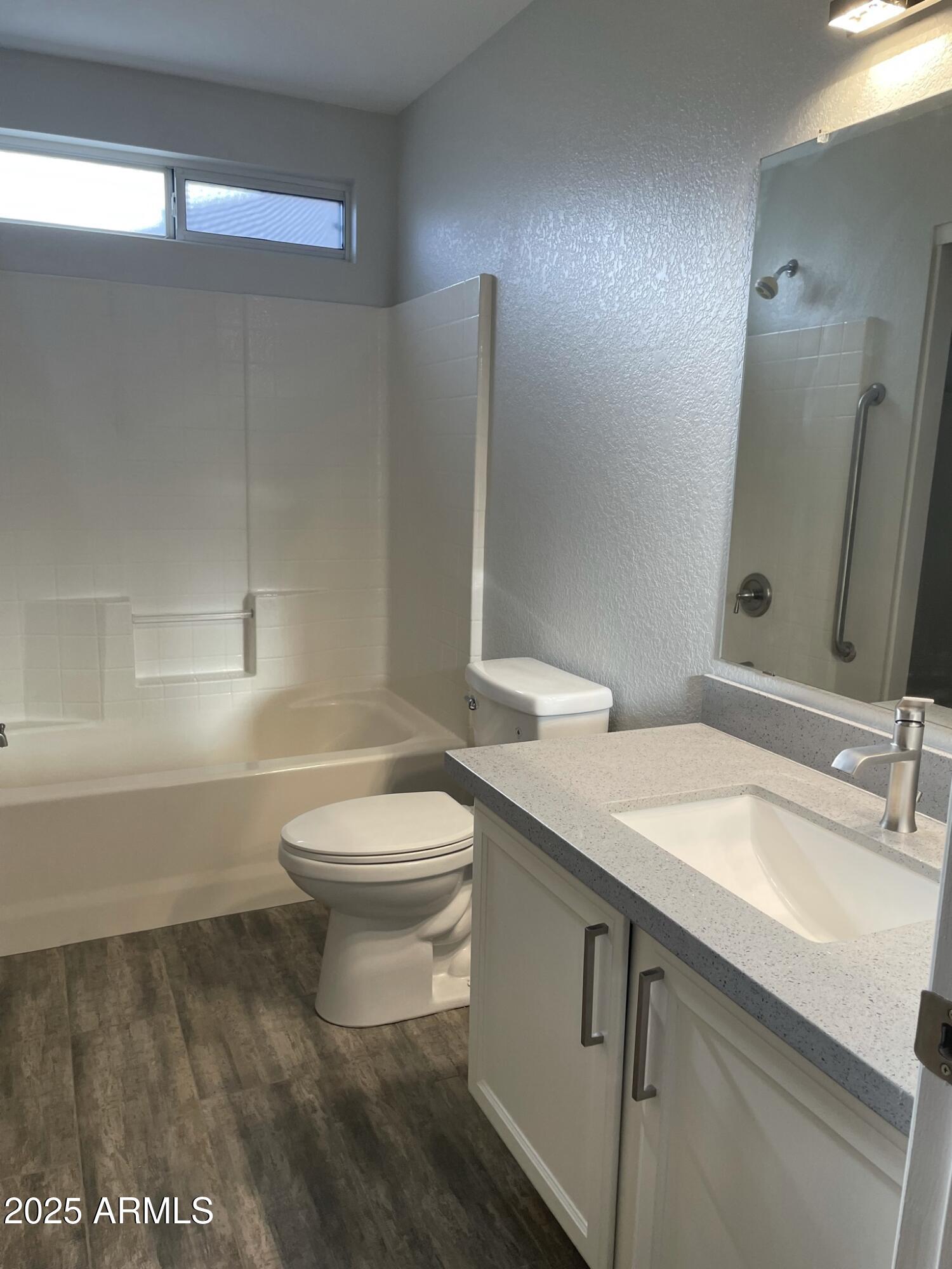 839 West 12th Avenue Apache Junction, AZ 85120 - Photo 15 of 26 a bathroom with a sink a toilet and shower