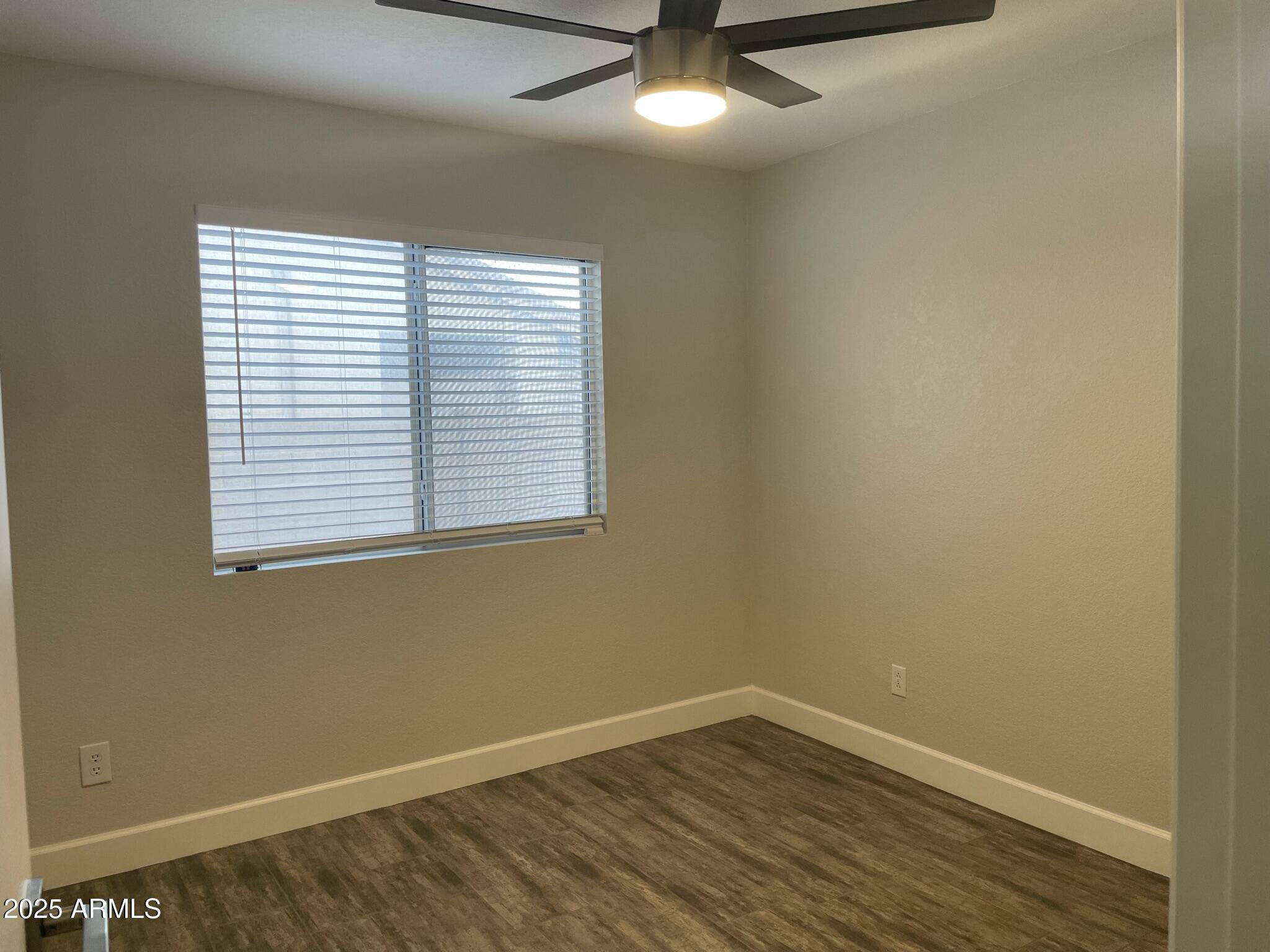 839 West 12th Avenue Apache Junction, AZ 85120 - Photo 16 of 26 an empty room with a window