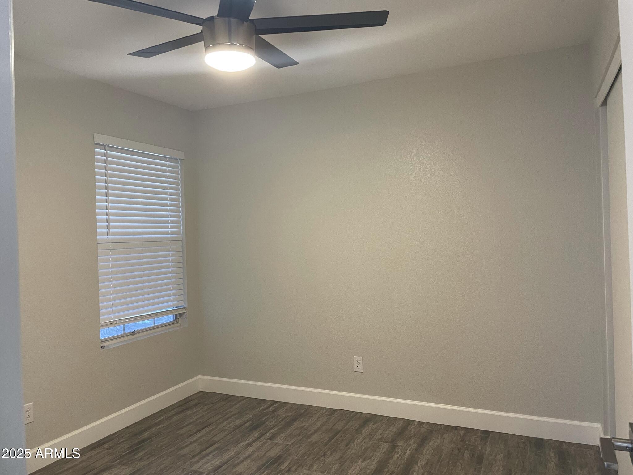 839 West 12th Avenue Apache Junction, AZ 85120 - Photo 18 of 26 wooden floor in an empty room