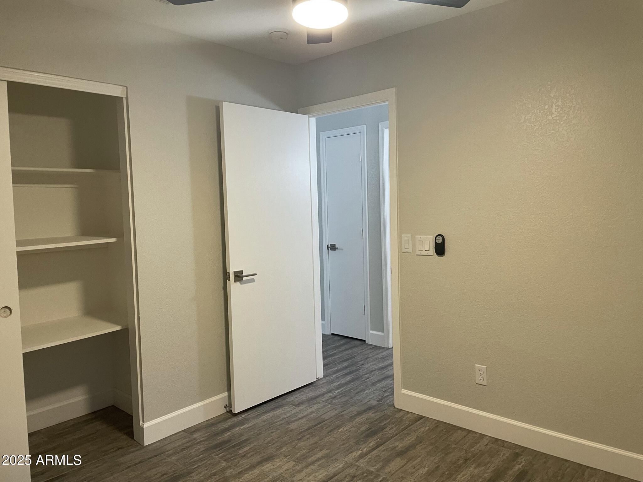 839 West 12th Avenue Apache Junction, AZ 85120 - Photo 19 of 26 a view of a room with wooden floor