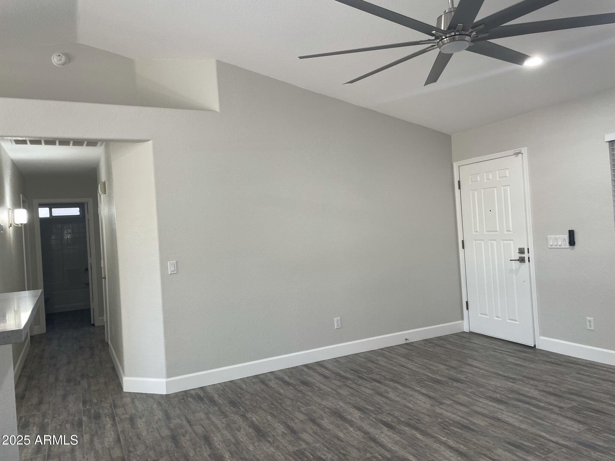 839 West 12th Avenue Apache Junction, AZ 85120 - Photo 9 of 26 wooden floor in an empty room