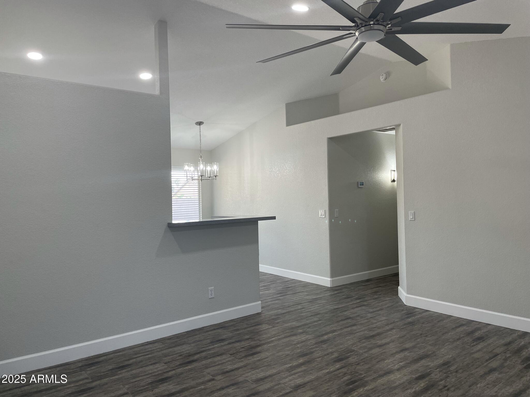 839 West 12th Avenue Apache Junction, AZ 85120 - Photo 10 of 26 wooden floor in an empty room with a window